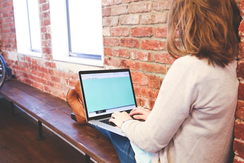 Writer Typing on Keyboard